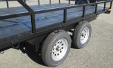 8 x 12 Custom ATV Trailer with 7,000lb GVWR, Two Axles with One Electric Braking, 8' Wide Over The Wheels, 1 ½" Square Tubing Frame, 13" 5 on 4 ½ Tires & Wheels, 11" Rail Side Rail, 2,000lb Tongue Jack, Pintle Coupler, Painted Trailer Undercarriage, Breakaway Kit, 7 Way Plug, Spare Trei Mount, Box on Tongue, 12 - 1/2" D Rings, 4 - Flush Mount D Rings, 5' Ramp Gate, Spring Assist on Both Sides on Ramp 