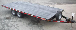 102" x 20' Flat Bed Trailer Custom Built with 7,000lb GVWR, Channel Iron Frame, Formed Flat Bed Material Bed, Electric Brakes Both Axles, 2X10 Douglas Fir Decking, 8' Ramps with Storage at Back, Breakaway Kit, 7 Way Plug, Spare Tire and Wheel, Spare Tire Mount, 24 Pockets: 8 Each Side, 4 at Front and 4 at Rear, 2 5/16" Coupler with Safety Chains, Painted Trailer Undercarriage