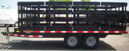102" x 16' Custom Tandem Axle Flat Bed Trailer Built with 9,995lb GVWR, Two 5,200lb Electric Braking Axles, Breakaway Kit, 7 Way Plug, 7,000lb Drop Leg Jack, A Frame Box on Tongue, Integrated Pockets, 16 Gauge Slats, Stakes, Gate Hardware, Channel Iron Frame, Formed Flat Bed Material Bed, 2X10 Douglas Fir Decking, Painted Trailer Undercarriage