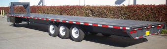 Custom 102 x 36' Flat Bed Trailer with 9,995lb GVWR , 3 - 7,000lb Axles, Two Axles Electric Brakes, Channel Iron Frame, 235/80R16 Tires and Wheels, 2X10 Douglas Fir Decking, Painted Trailer and Undercarriage Medium Gray, Jacks, Rub Rail with Pockets, Box in Front, Spare Tire on Gooseneck, Step up to Deck, White Modular Rims, LED Lights, 10' Aluminum Ramps Stored Out the Rear