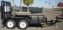 6' X 10' Standard Utility Trailer Built with 7,000lb GVWR, Tandem Axle Both Electric Braking Axles, Breakaway Kit with 7 Way Plug, 2 5/16 Coupler with Safety Chains, 4" Drop Axles, Z Tongue 7,000lb Drop Leg Jack, 4- 1/2" D-Rings, Ramp with Spring Assist, Stabilizers on Back