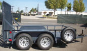 6 x 10 Custom Tandem Axle Trailer Built by Pac West with 7,000lb. GVWR, Two 3,500lb 4" Drop Axles, 2 5/16” A Frame Coupler, Equalizer/Leaf Spring Suspension, 15” / 5 on 5 / Tires & Wheels, 2,000lb. Jack, 3 x 2 x 3/16 Angle Top Rail, 4” Channel Tongue, Painted Trailer Undercarriage (On Pac West Manufactured Trailer), Spare Tire and Wheel, Spare Tire Mount, Upright Runners 2'8" Outside on Ramp, Color Gray. This customer trailer is designed for low profile equipment such as Scissor Lifts