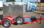 Custom 6 x 8 Light Hauler Trailer with 3,500lb. GVWR, 3,500lb. 4" Drop Electric Braking Axle, Breakaway Kit, 7 Way Plug, Z Tongue, Jet Ski Box, Chrome Wheels with Caps and Lug Nuts, Spare Tire and Wheel, Spare Tire Mount, 3/16" Aluminum Overwood and Around Machine, LED Lights, 2 5/16” A Frame Coupler, 2,000lb. Top Wind Jack, 15” 5 on 5 Trailer Rated Tires & Wheels, Painted Red Trailer and Undercarriage